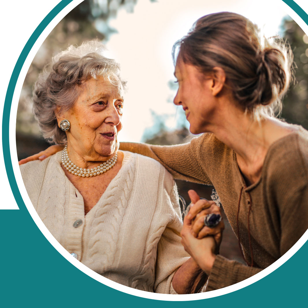 Older woman speaking with a younger woman